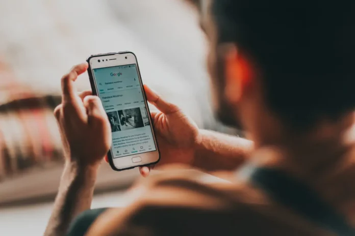 a man holding a cell phone